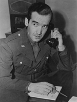 Murrow pictured in uniform with telephone