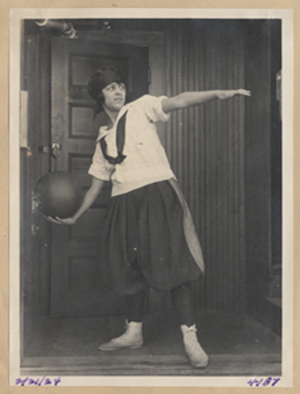 Girl throwing basketball